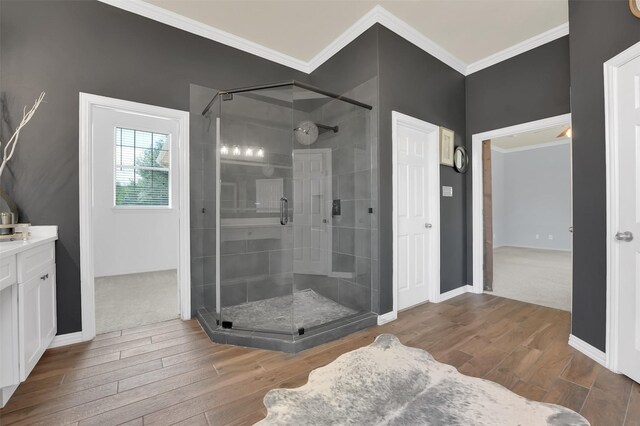 621 Maize Rd, Murphy, TX 75094 - full bath featuring a shower stall, wood finished floors, crown molding, vanity, and baseboards