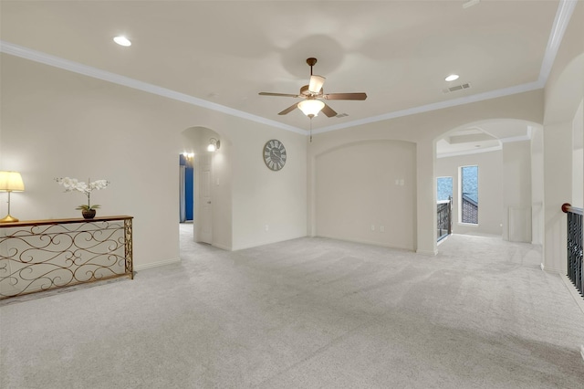 621 Maize Rd, Murphy, TX 75094 - unfurnished living room with arched walkways, carpet floors, ceiling fan, crown molding, and baseboards