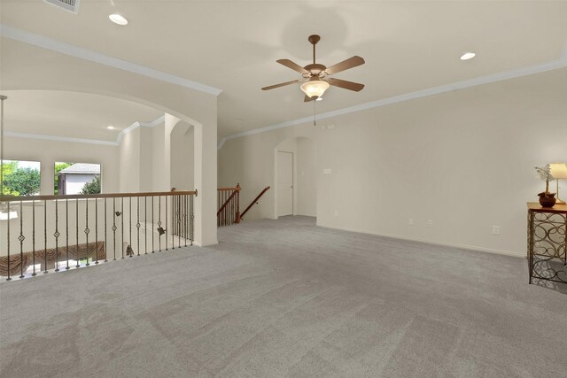 621 Maize Rd, Murphy, TX 75094 - spare room with a ceiling fan, arched walkways, carpet flooring, crown molding, and recessed lighting