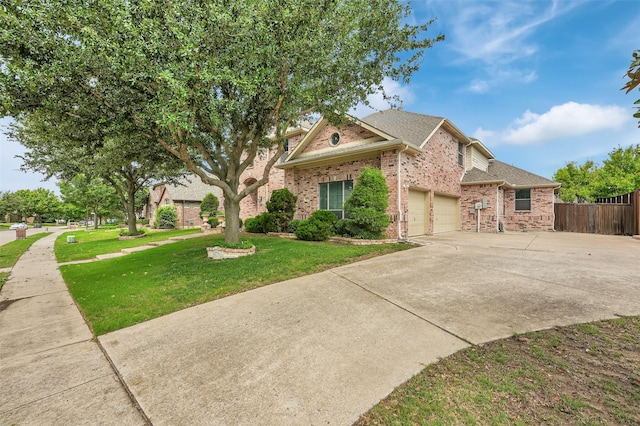 621 Maize Rd, Murphy, TX 75094 - view of front of home featuring brick siding, driveway, an attached garage, and roof with shingles
