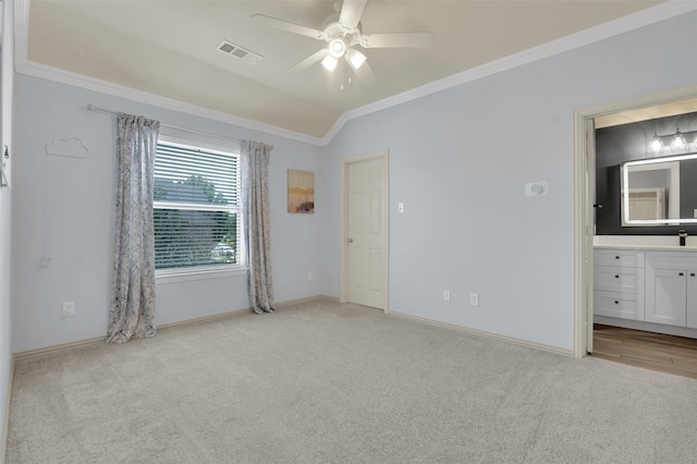 621 Maize Rd, Murphy, TX 75094 - unfurnished bedroom with light carpet, ornamental molding, baseboards, ensuite bath, and lofted ceiling