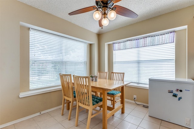 2401 Loon Lake Rd, Denton, TX 76210 - dining space with a ceiling fan, baseboards, light tile patterned floors, and a textured ceiling