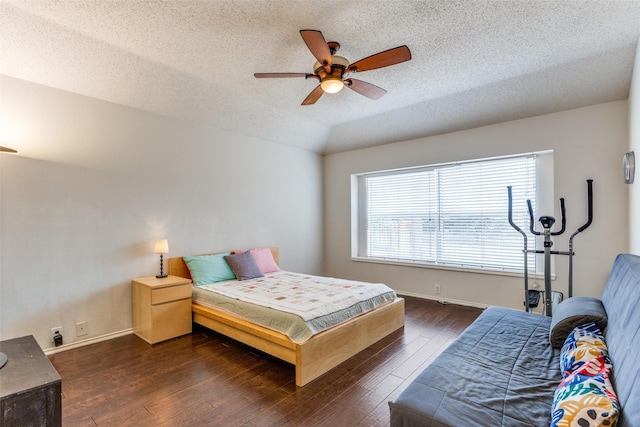 2401 Loon Lake Rd, Denton, TX 76210 - bedroom featuring dark wood-style flooring, a textured ceiling, ceiling fan, and baseboards