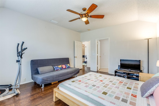2401 Loon Lake Rd, Denton, TX 76210 - bedroom with hardwood / wood-style flooring, a ceiling fan, a textured ceiling, vaulted ceiling, and baseboards