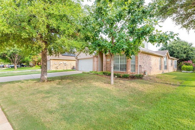 2401 Loon Lake Rd, Denton, TX 76210 - obstructed view of property featuring brick siding, a front yard, and concrete driveway