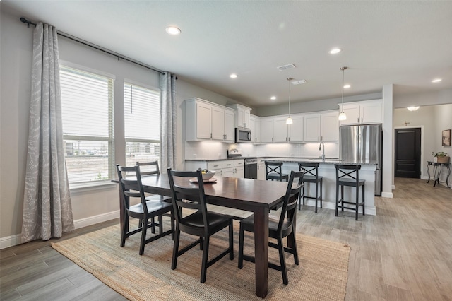 1713 Brindle St, Justin, TX 76247 - dining space with baseboards, light wood-type flooring, and recessed lighting