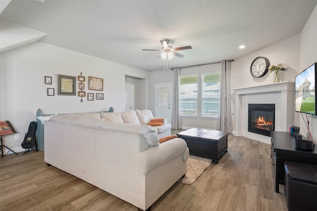 1713 Brindle St, Justin, TX 76247 - living area with a ceiling fan, a glass covered fireplace, light wood-style floors, recessed lighting, and baseboards