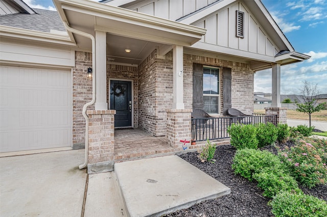 1713 Brindle St, Justin, TX 76247 - doorway to property featuring board and batten siding, covered porch, an attached garage, and brick siding