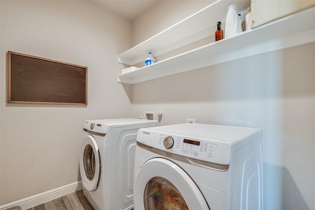 1713 Brindle St, Justin, TX 76247 - washroom featuring washer and clothes dryer, wood finished floors, and baseboards