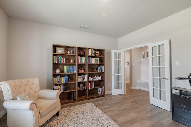 1713 Brindle St, Justin, TX 76247 - sitting room with french doors, light wood-type flooring, and baseboards