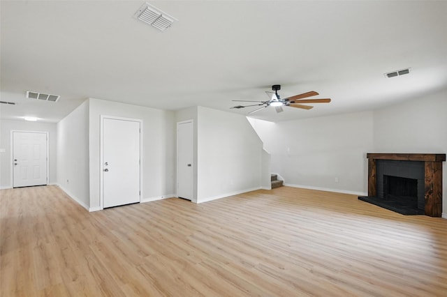 1126 Mazourka Dr, Arlington, TX 76001 - unfurnished living room with stairs, baseboards, a ceiling fan, and light wood finished floors