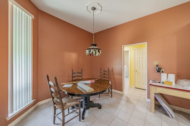 8300 Red Rose Trl, North Richland Hills, TX 76182 - dining area featuring light tile patterned floors, baseboards, and washer / dryer
