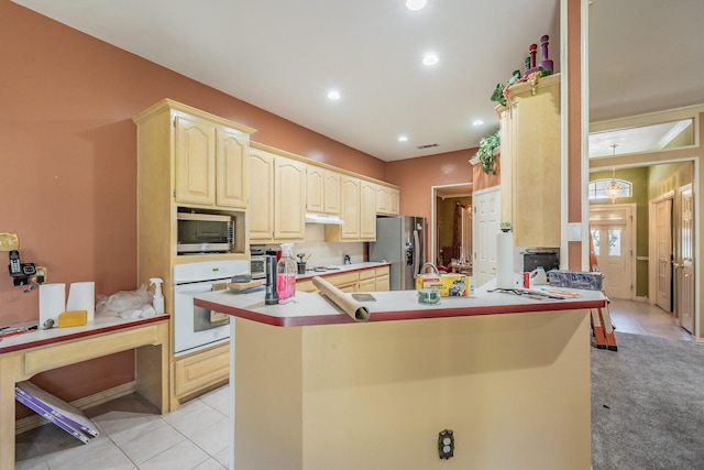 8300 Red Rose Trl, North Richland Hills, TX 76182 - kitchen with stainless steel appliances, under cabinet range hood, light tile patterned floors, recessed lighting, and a peninsula