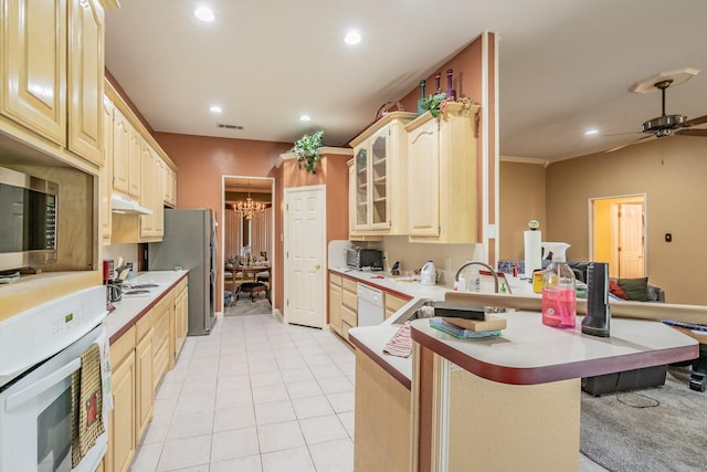 8300 Red Rose Trl, North Richland Hills, TX 76182 - kitchen with appliances with stainless steel finishes, a peninsula, recessed lighting, light countertops, and glass insert cabinets