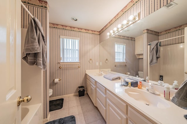 8300 Red Rose Trl, North Richland Hills, TX 76182 - full bath with toilet, wallpapered walls, double vanity, tile patterned flooring, and baseboards