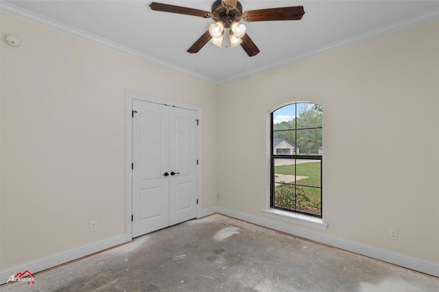 9445 N Pointe Cir, Greenwood, LA 71033 - unfurnished bedroom featuring baseboards, crown molding, a closet, a ceiling fan, and concrete flooring