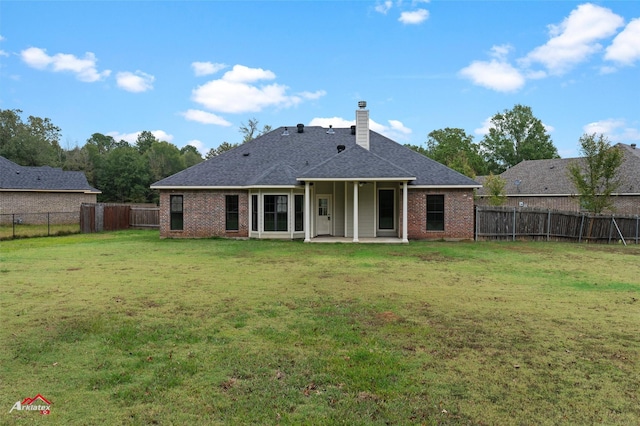 9445 N Pointe Cir, Greenwood, LA 71033 - rear view of property featuring brick siding, a patio, a chimney, and roof with shingles