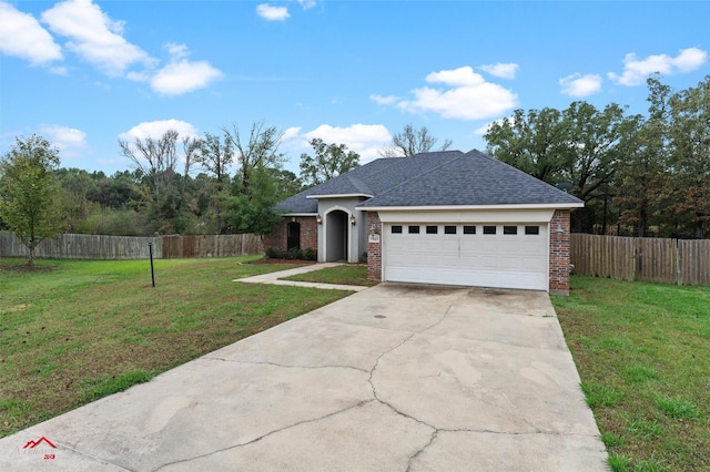 9445 N Pointe Cir, Greenwood, LA 71033 - view of front facade with brick siding, driveway, a garage, and a shingled roof