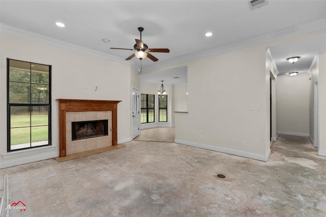 9445 N Pointe Cir, Greenwood, LA 71033 - unfurnished living room with unfinished concrete flooring, plenty of natural light, a ceiling fan, a tiled fireplace, and crown molding