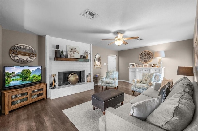 1210 Kay Dr, Weatherford, TX 76086 - living area featuring a fireplace, ceiling fan, wood finished floors, and baseboards