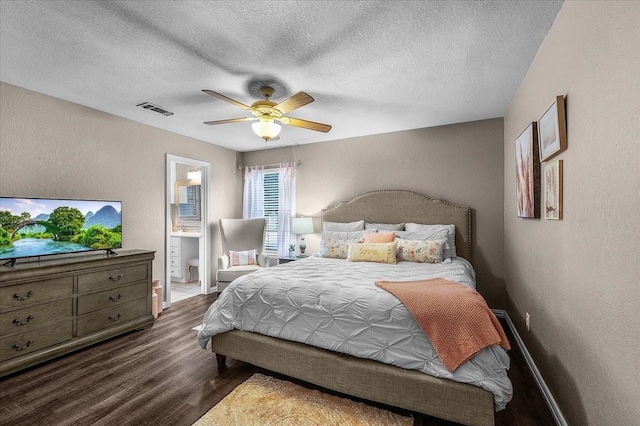 1210 Kay Dr, Weatherford, TX 76086 - bedroom featuring wood finished floors, a textured wall, a textured ceiling, baseboards, and ceiling fan