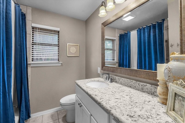 1210 Kay Dr, Weatherford, TX 76086 - bathroom with vanity, toilet, tile patterned floors, baseboards, and a shower with shower curtain