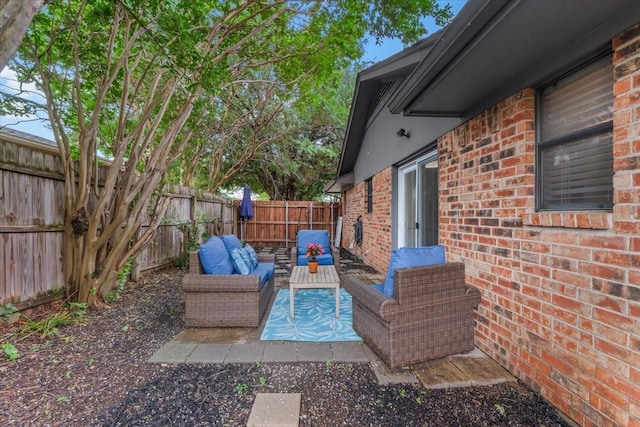 1210 Kay Dr, Weatherford, TX 76086 - fenced backyard featuring an outdoor living space and a patio area