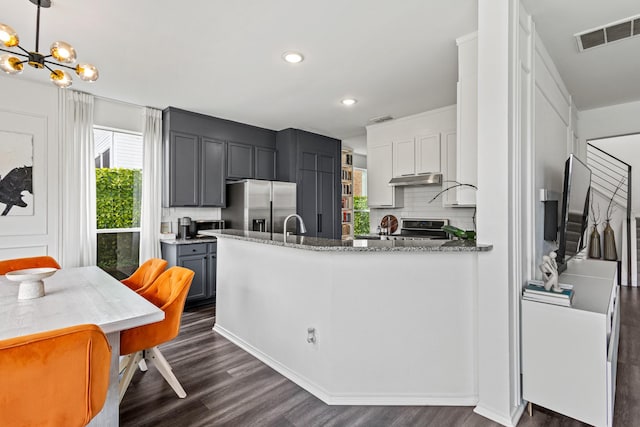 4932 Glenscape Trl, Fort Worth, TX 76137 - kitchen featuring stainless steel appliances, dark wood finished floors, healthy amount of natural light, decorative backsplash, and recessed lighting