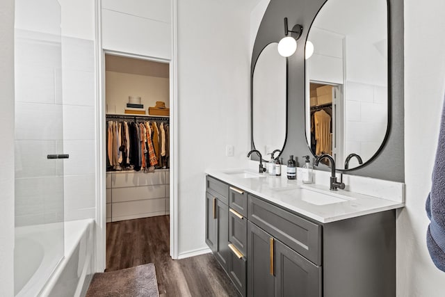 4932 Glenscape Trl, Fort Worth, TX 76137 - bathroom with wood finished floors, double vanity, and a walk in closet