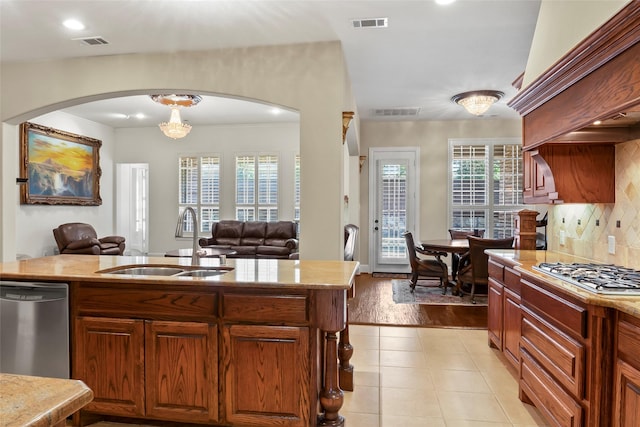 4211 Wilson Creek Trl, Prosper, TX 75078 - kitchen with stainless steel appliances, a sink, arched walkways, healthy amount of natural light, and recessed lighting