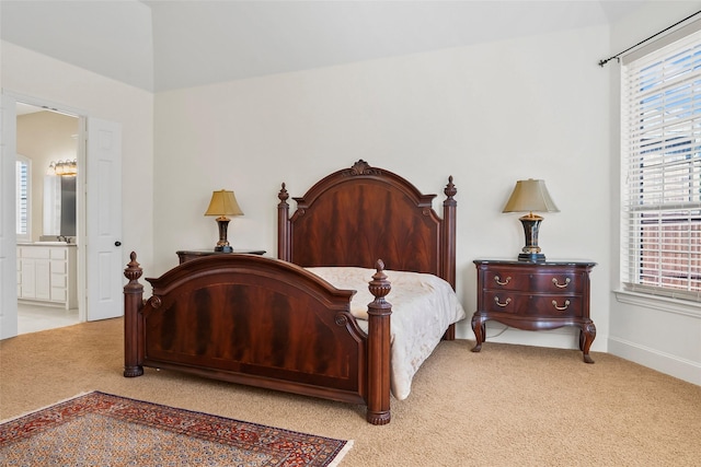 4211 Wilson Creek Trl, Prosper, TX 75078 - bedroom featuring light colored carpet, multiple windows, connected bathroom, and baseboards