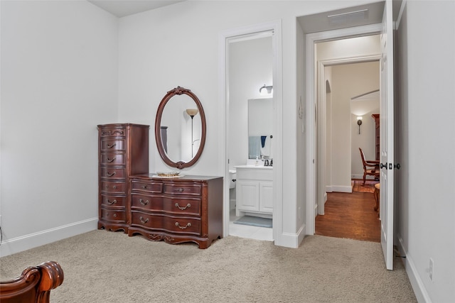 4211 Wilson Creek Trl, Prosper, TX 75078 - carpeted bedroom featuring ensuite bathroom, baseboards, and a sink
