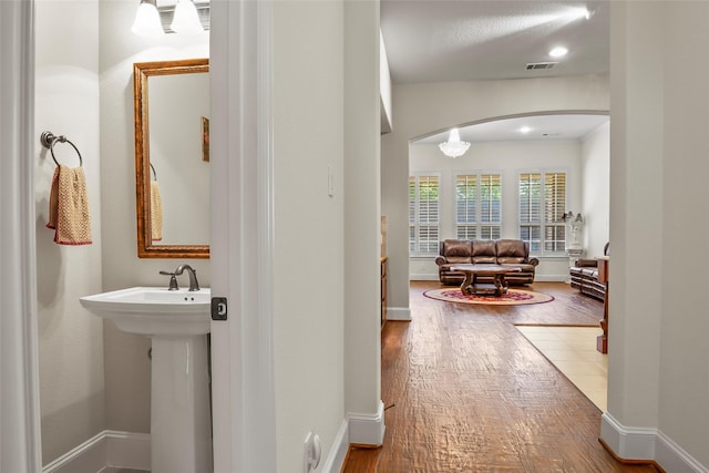 4211 Wilson Creek Trl, Prosper, TX 75078 - hallway featuring arched walkways, hardwood / wood-style flooring, baseboards, and recessed lighting