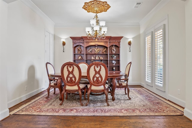 4211 Wilson Creek Trl, Prosper, TX 75078 - dining space featuring a chandelier, wood finished floors, healthy amount of natural light, baseboards, and crown molding