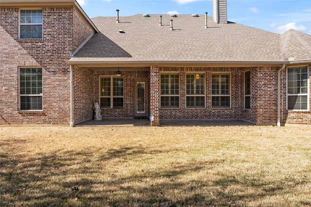 4211 Wilson Creek Trl, Prosper, TX 75078 - rear view of property with a shingled roof, a patio area, brick siding, and a yard