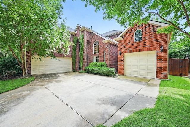 1190 Bonham Pkwy, Lantana, TX 76226 - traditional-style house featuring driveway, brick siding, and a garage