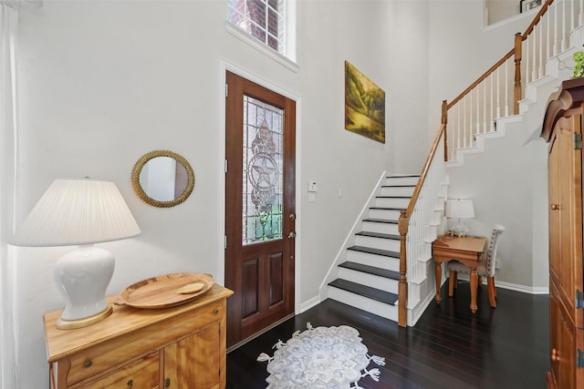 1190 Bonham Pkwy, Lantana, TX 76226 - entryway featuring stairs, dark wood-type flooring, plenty of natural light, and a towering ceiling
