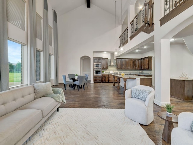 4603 Whitestone Dr, Parker, TX 75002 - living area featuring high vaulted ceiling, dark wood-style floors, arched walkways, healthy amount of natural light, and beam ceiling