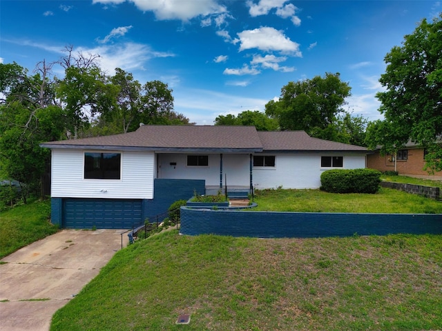 7401 Trimble Dr, Fort Worth, TX 76134 - ranch-style home featuring a front yard, an attached garage, and concrete driveway
