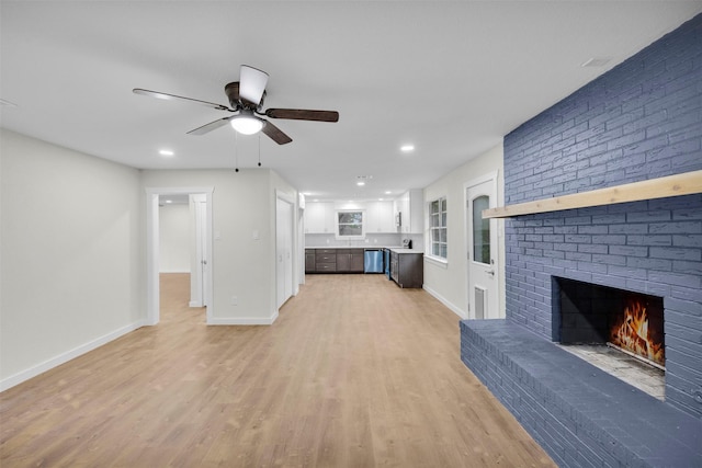 7401 Trimble Dr, Fort Worth, TX 76134 - unfurnished living room with a fireplace, light wood-type flooring, baseboards, ceiling fan, and recessed lighting