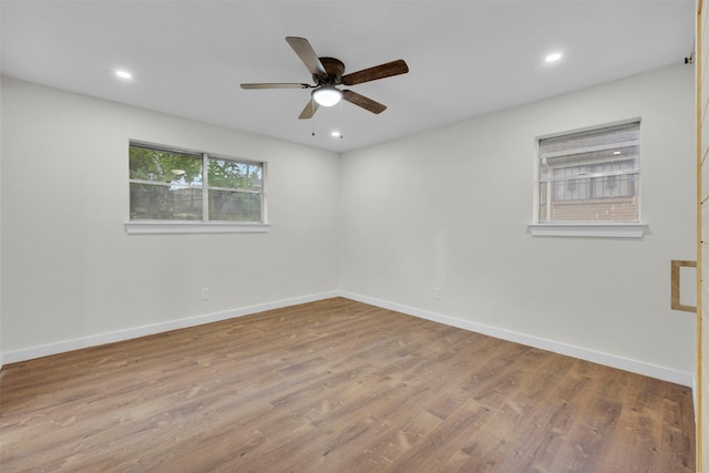 7401 Trimble Dr, Fort Worth, TX 76134 - spare room featuring wood finished floors, a ceiling fan, baseboards, and recessed lighting