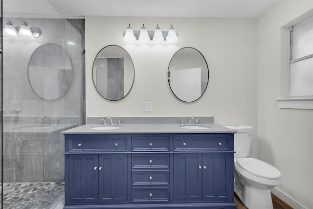 7401 Trimble Dr, Fort Worth, TX 76134 - full bath with double vanity, toilet, and a tile shower
