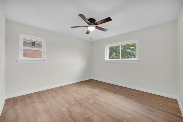 7401 Trimble Dr, Fort Worth, TX 76134 - unfurnished room with wood finished floors, baseboards, and a ceiling fan