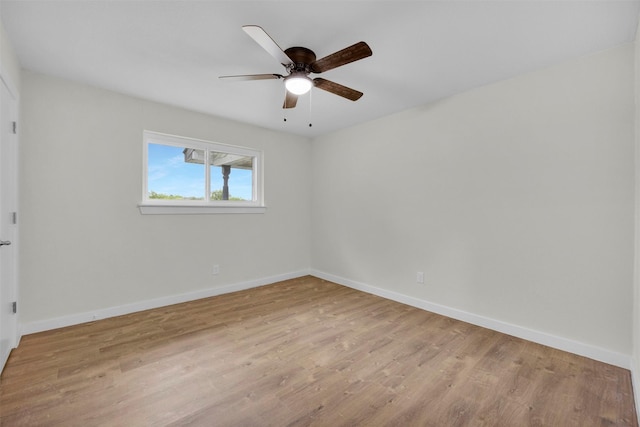 7401 Trimble Dr, Fort Worth, TX 76134 - unfurnished room with wood finished floors, baseboards, and ceiling fan