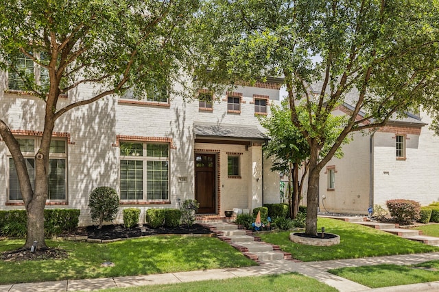 828 Lake Vista Pl, Coppell, TX 75019 - view of front facade with a front yard and brick siding
