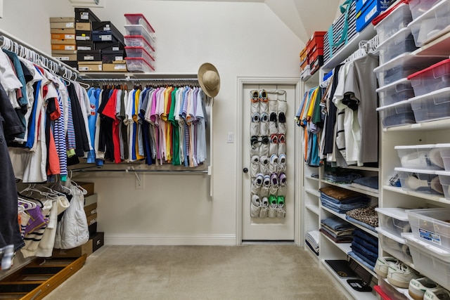 828 Lake Vista Pl, Coppell, TX 75019 - walk in closet with carpet floors and lofted ceiling