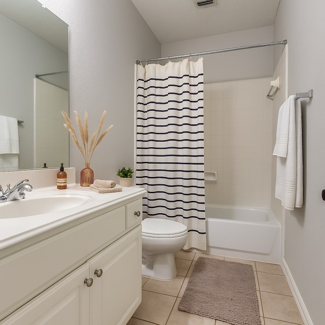 7491 Daffodil Way, Frisco, TX 75033 - bathroom with vanity, tile patterned floors, shower / bath combo, and toilet