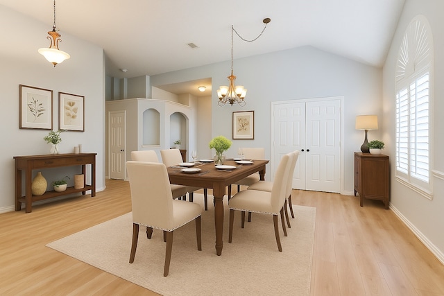 7491 Daffodil Way, Frisco, TX 75033 - dining room with light wood-style floors, a chandelier, vaulted ceiling, and baseboards