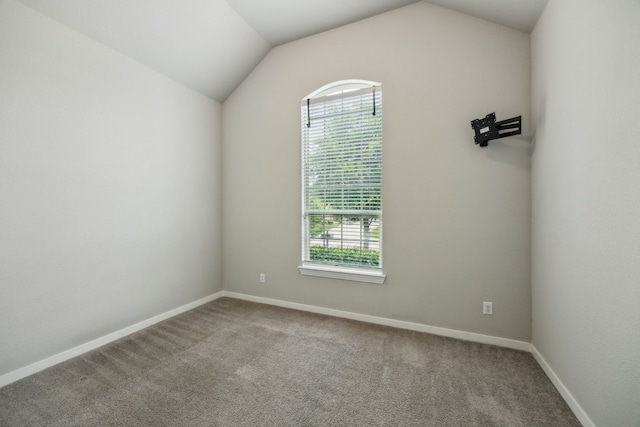 1529 Calcot Ln, Forney, TX 75126 - unfurnished room featuring plenty of natural light, lofted ceiling, carpet floors, and baseboards