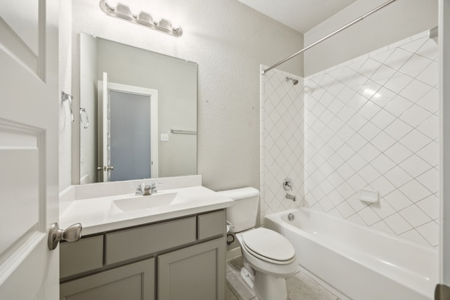 1529 Calcot Ln, Forney, TX 75126 - full bathroom with toilet, vanity,  shower combination, and a textured wall